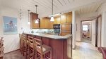 Fully equipped kitchen with dining table and breakfast bar 